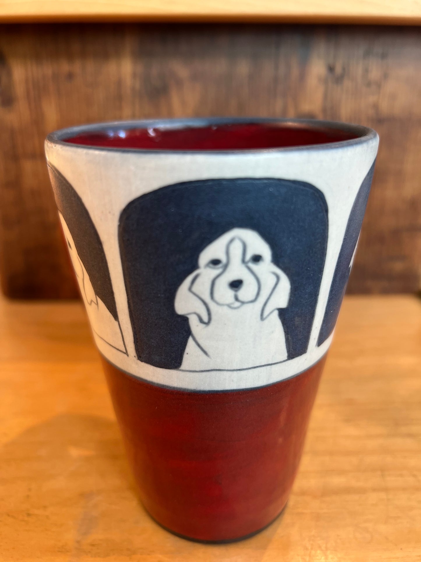 Dogs on Coffee Cup 5”x3 1/2” by Sally Jaffee