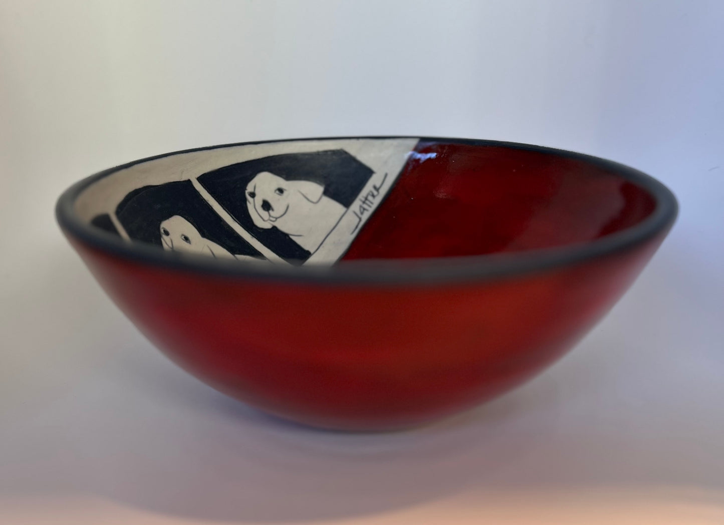 Dogs on Bowl 7.5"x3" by Sally Jaffee